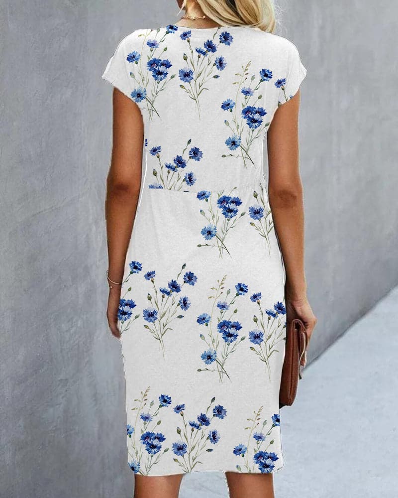 Anika - Hvid kjole med blåt blomsterprint