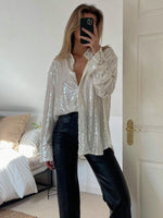 Oversized glitterbluse til kvinder