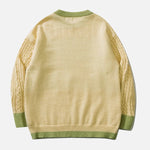 Sabrina - kabelstrikket sweater med pastelsky motiv