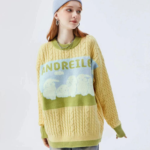 Sabrina - kabelstrikket sweater med pastelsky motiv